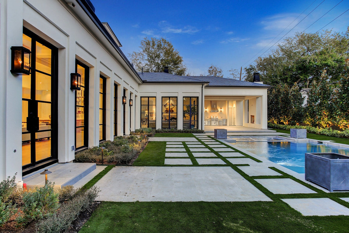 Luxury Texas home entrance with Colonial iron doors — hero